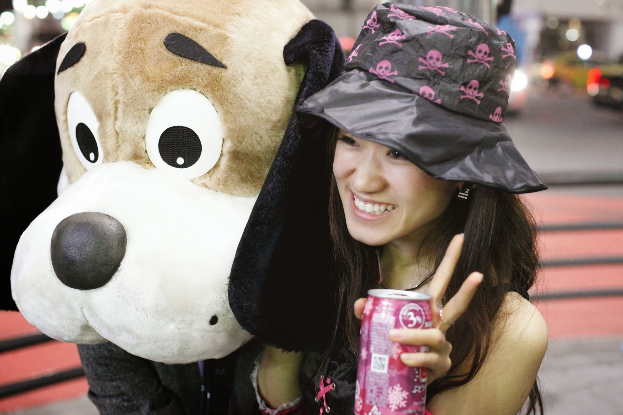 picture of a girl with a large, stuffed dog toy